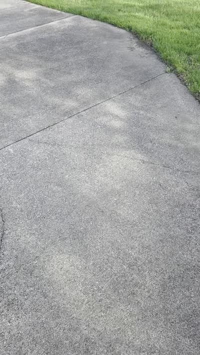 Concrete walkway being cleaned